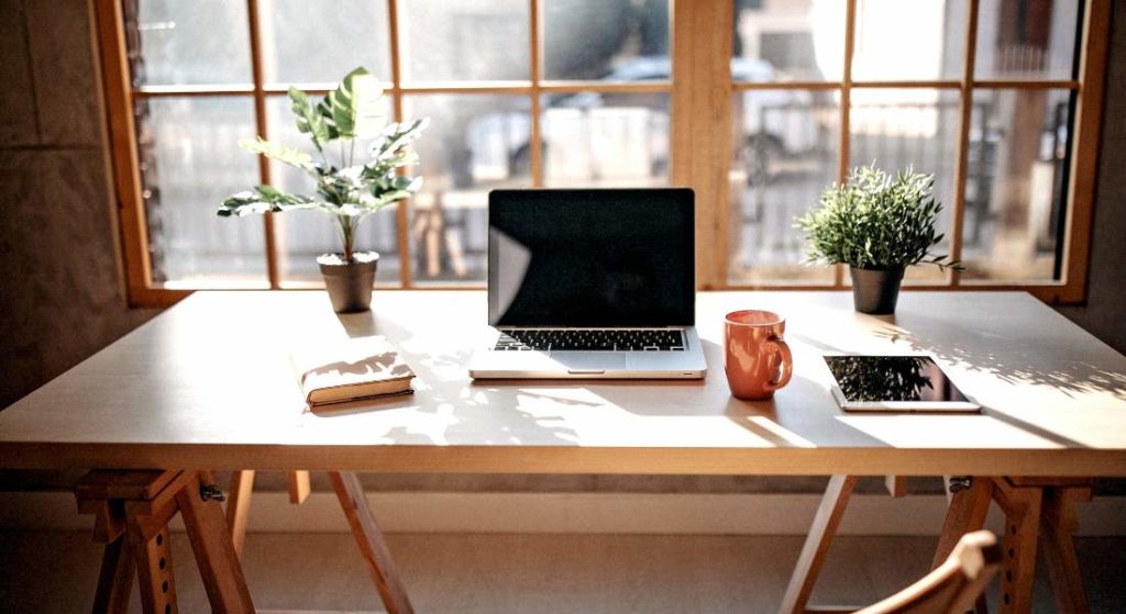 Laptop on Desk in front of window