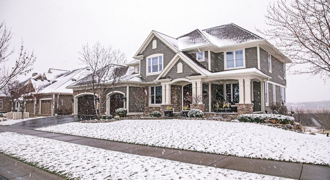 Two story house in the snow.